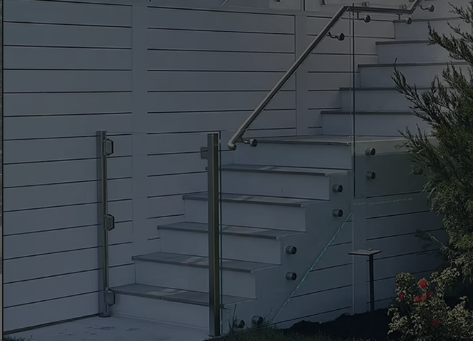 Standoff glass railing with stainless steel hardware
