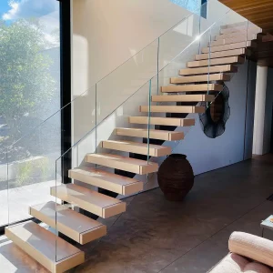Semi-frameless glass railing installed on residential staircase
