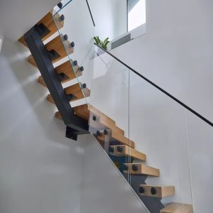 Standoff Glass Railings with Metal Top Rail in Modern Home